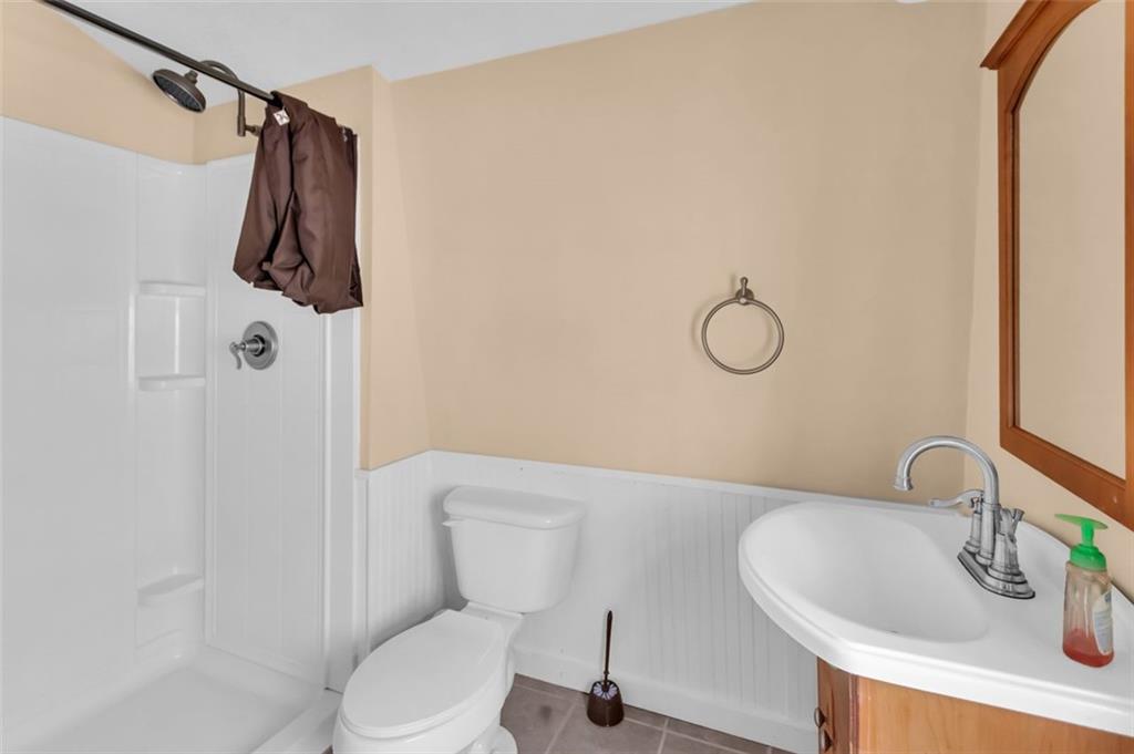 231 Lookout Ridge Road Cleveland, GA 30528 - Photo 16 of 20 a white toilet sitting next to a bathroom sink