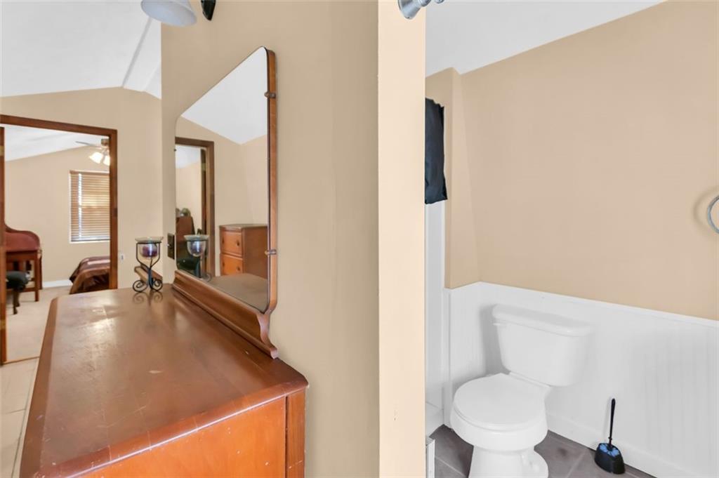 231 Lookout Ridge Road Cleveland, GA 30528 - Photo 17 of 20 a bathroom with a sink a toilet a mirror and shower