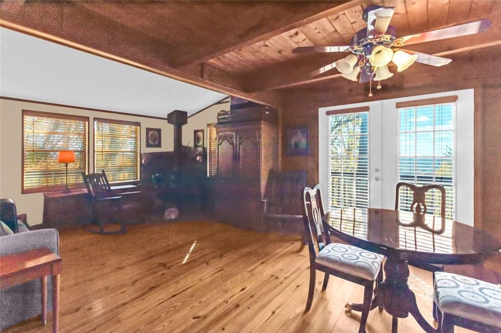 231 Lookout Ridge Road Cleveland, GA 30528 - Photo 7 of 20 a view of a livingroom with furniture wooden floor and chandelier