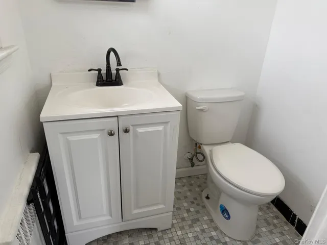 a bathroom with a toilet and a sink