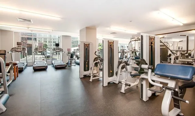 a view of a swimming pool with outdoor seating