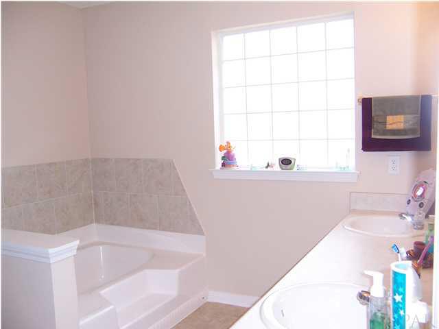 151 Gunwale Road Pensacola, FL 32507 - Photo 12 of 15 Master Bathroom with Double Vanity Sinks, Acrylic Block Window, and Garden Tub!