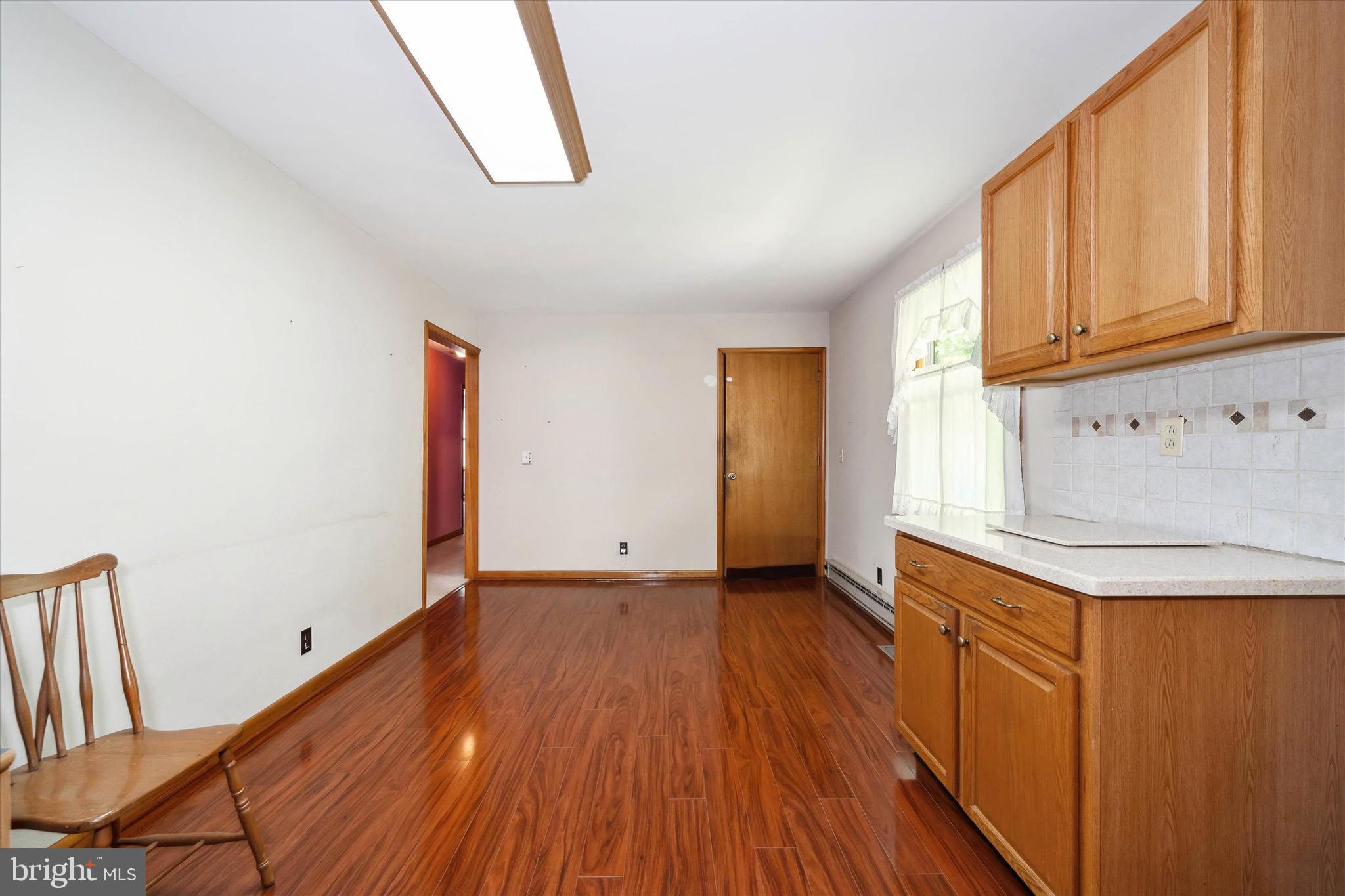197-199 Pine Tree Road Townsend, DE 19734 - Photo 28 of 62 a view of a kitchen with wooden floor and electronic appliances