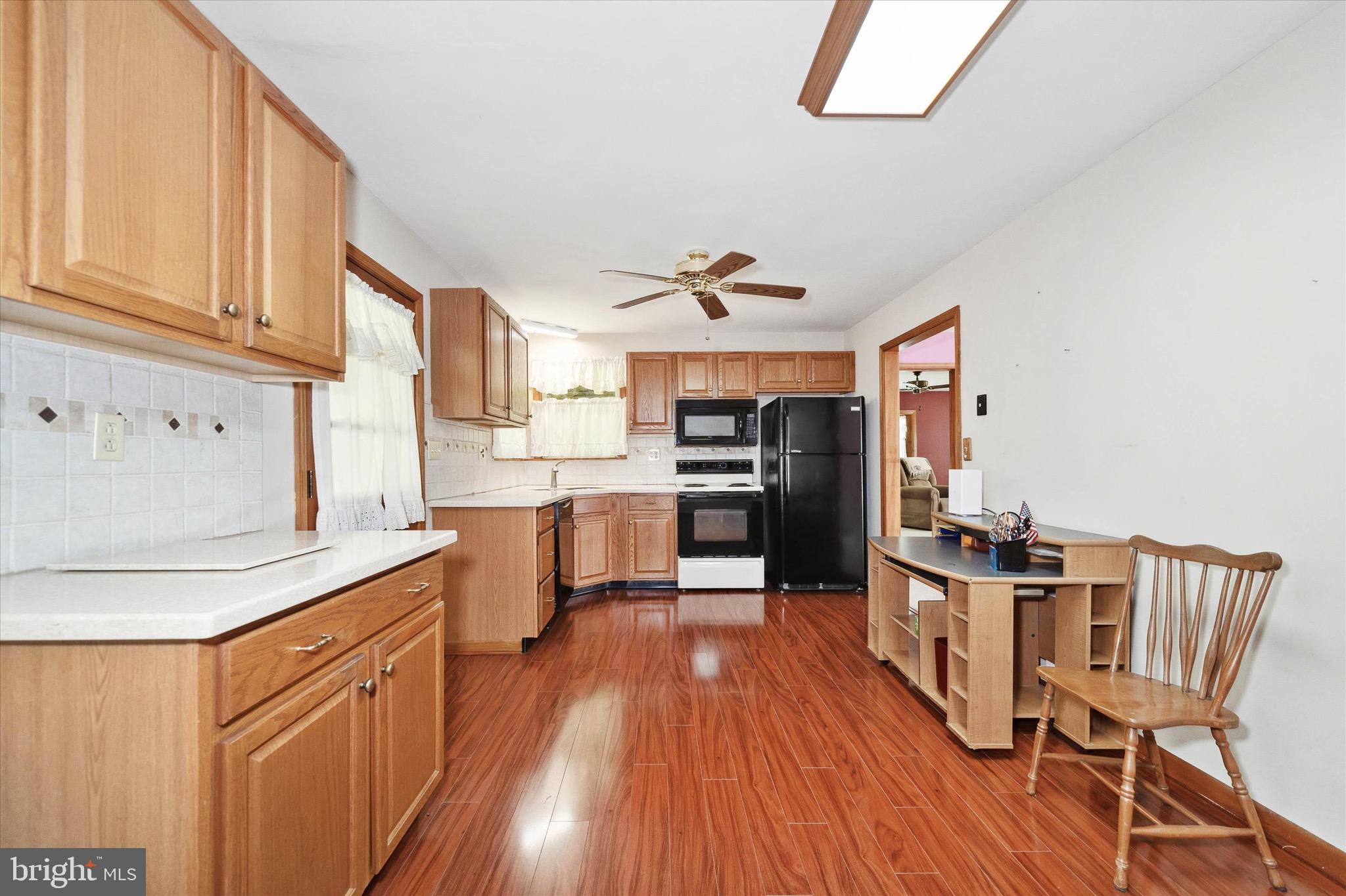 197-199 Pine Tree Road Townsend, DE 19734 - Photo 30 of 62 a kitchen with stainless steel appliances a stove a sink dishwasher and a refrigerator