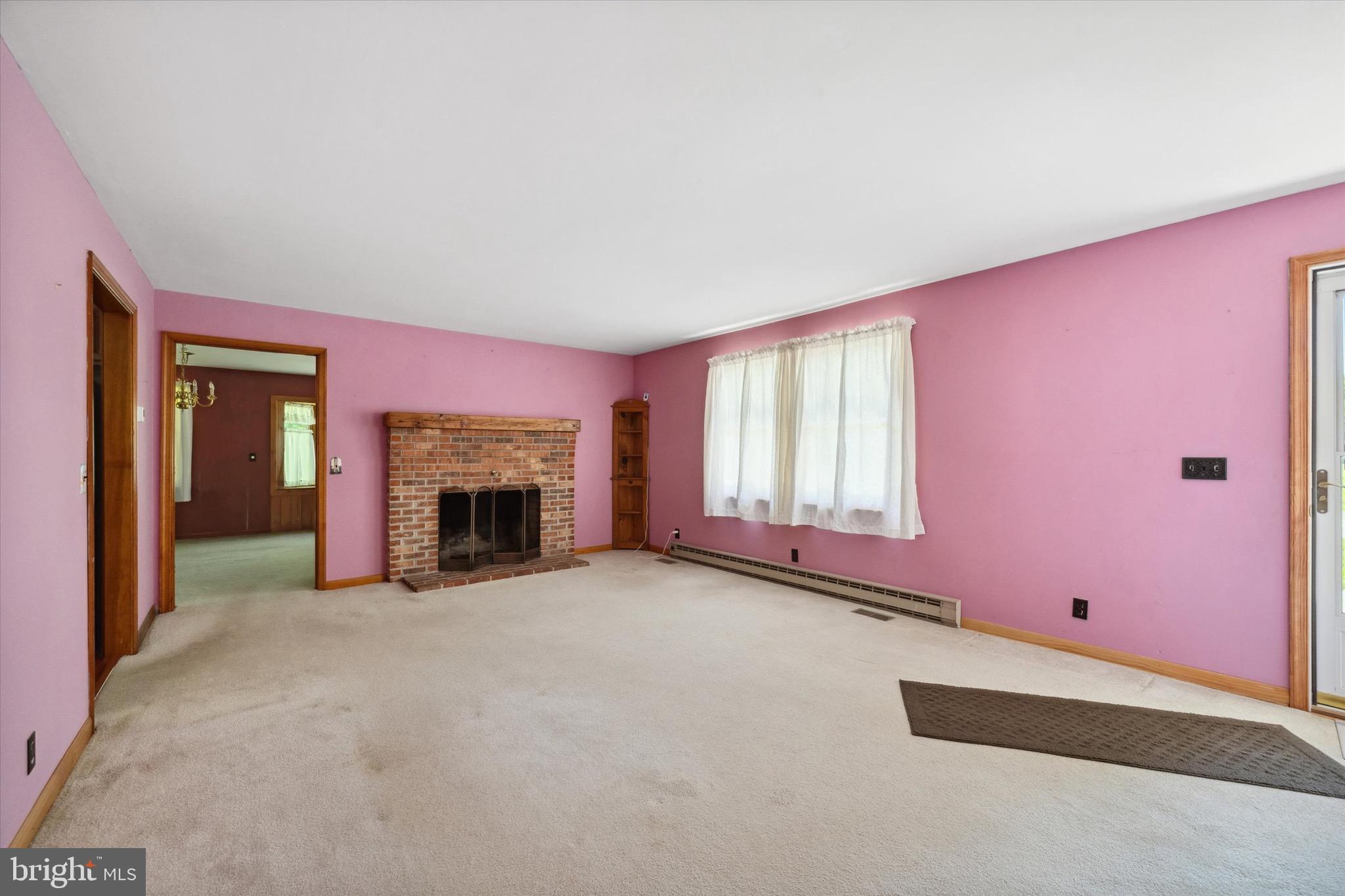 197-199 Pine Tree Road Townsend, DE 19734 - Photo 37 of 62 an empty room with windows and fireplace