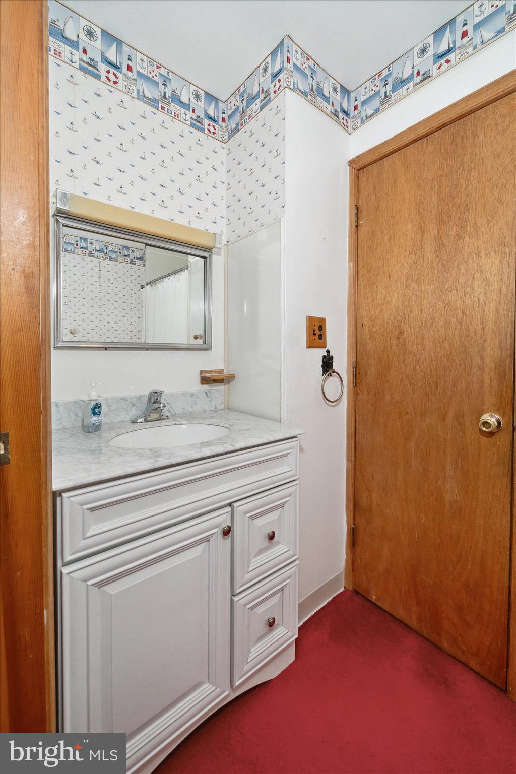 197-199 Pine Tree Road Townsend, DE 19734 - Photo 43 of 62 a bathroom with a granite countertop sink a mirror a vanity and a shower