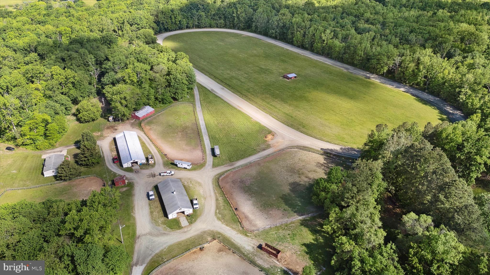 197-199 Pine Tree Road Townsend, DE 19734 - Photo 8 of 62 an aerial view of a house with a yard and trees all around