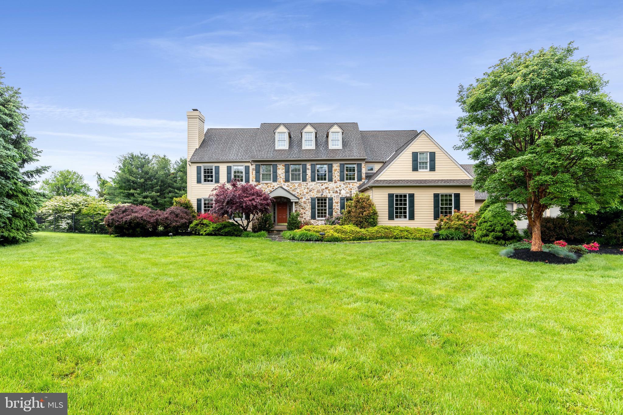 1860 Covered Bridge Road Malvern, PA 19355 - Photo 3 of 59 a front view of a house with a garden and trees