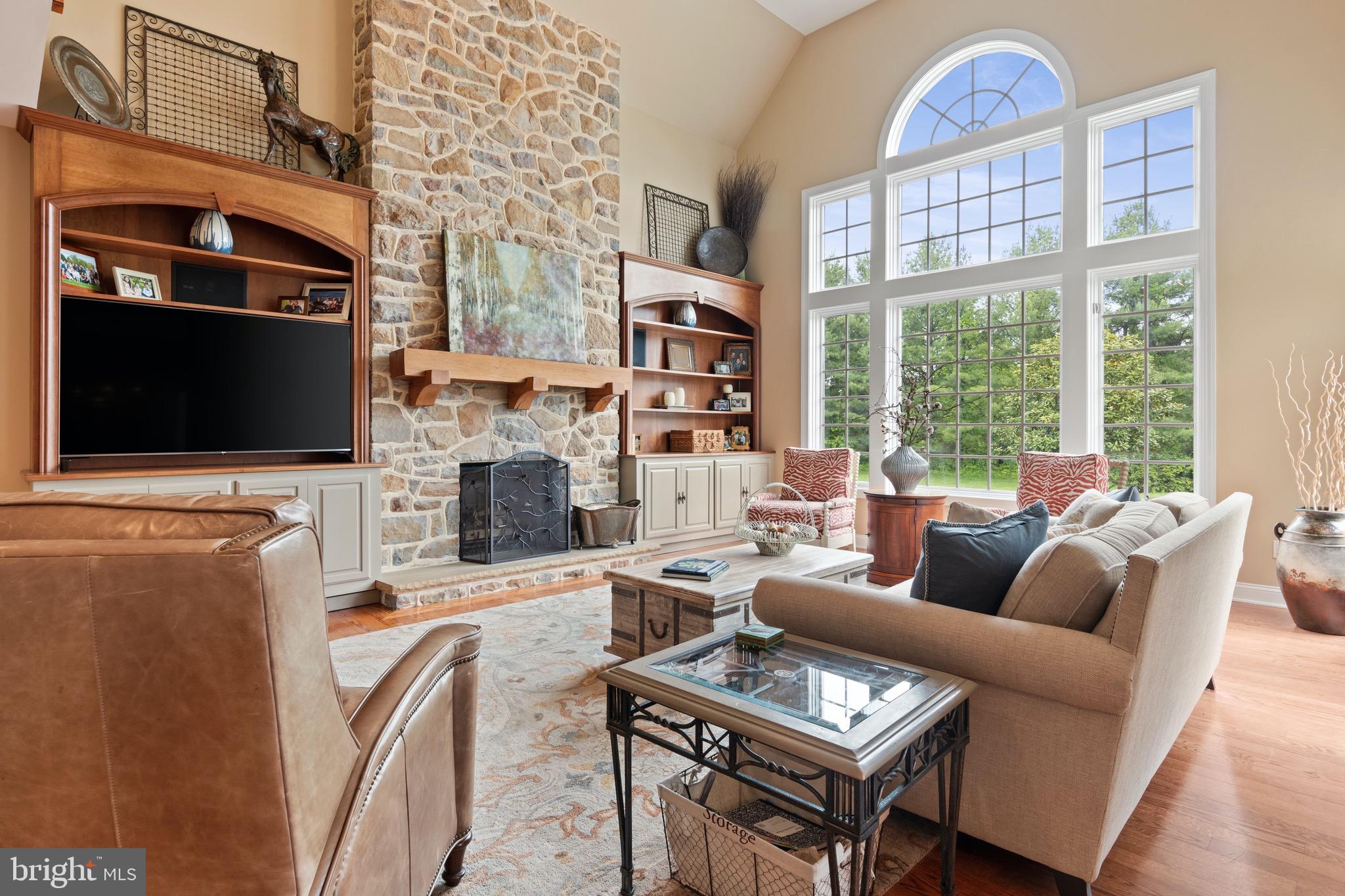 1860 Covered Bridge Road Malvern, PA 19355 - Photo 23 of 59 a living room with fireplace furniture and a flat screen tv