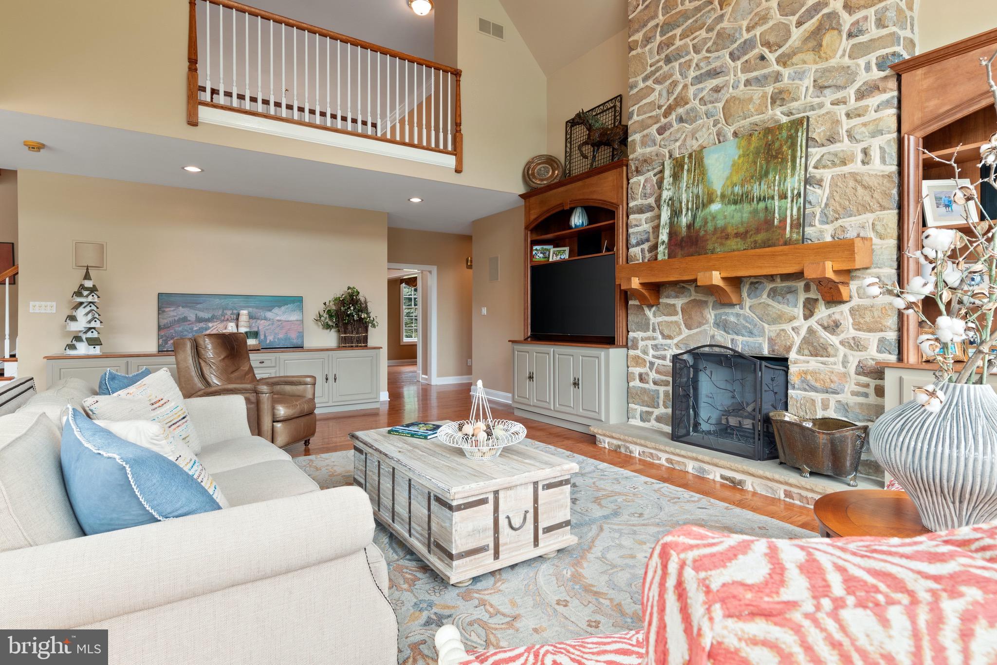 1860 Covered Bridge Road Malvern, PA 19355 - Photo 24 of 59 a living room with furniture a fireplace and a flat screen tv