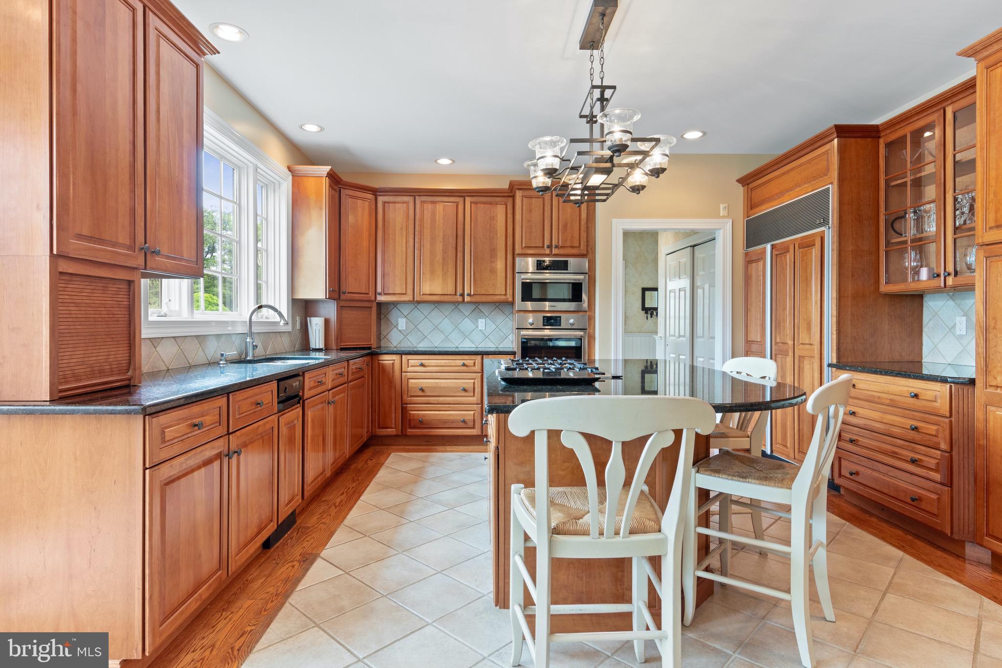 1860 Covered Bridge Road Malvern, PA 19355 - Photo 28 of 59 a large kitchen with a table and chairs
