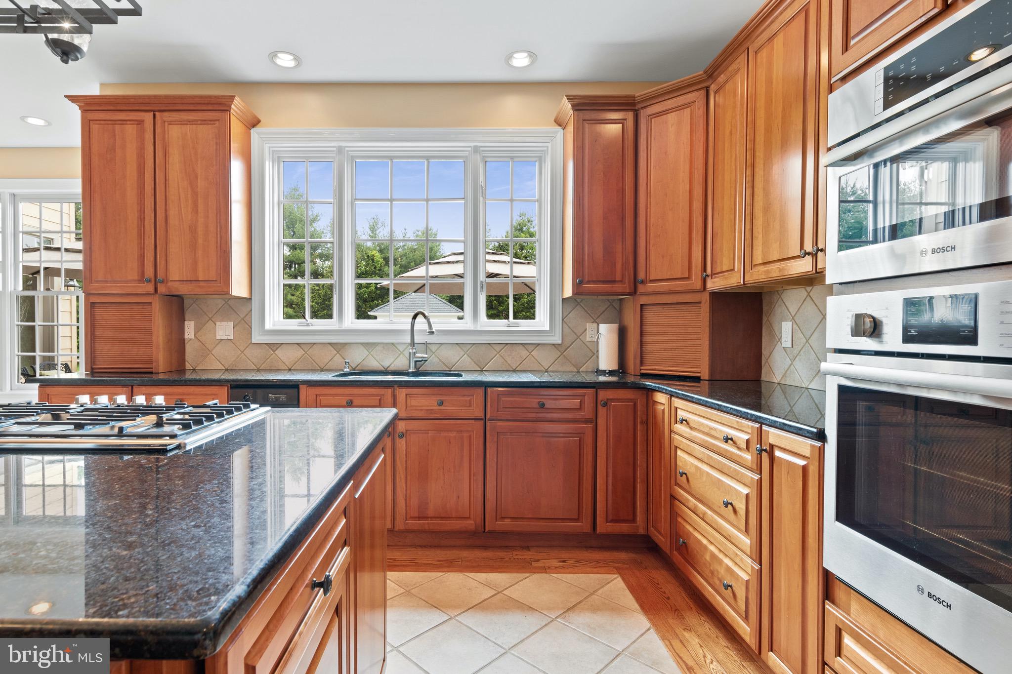 1860 Covered Bridge Road Malvern, PA 19355 - Photo 29 of 59 a kitchen with stainless steel appliances granite countertop a sink and a stove