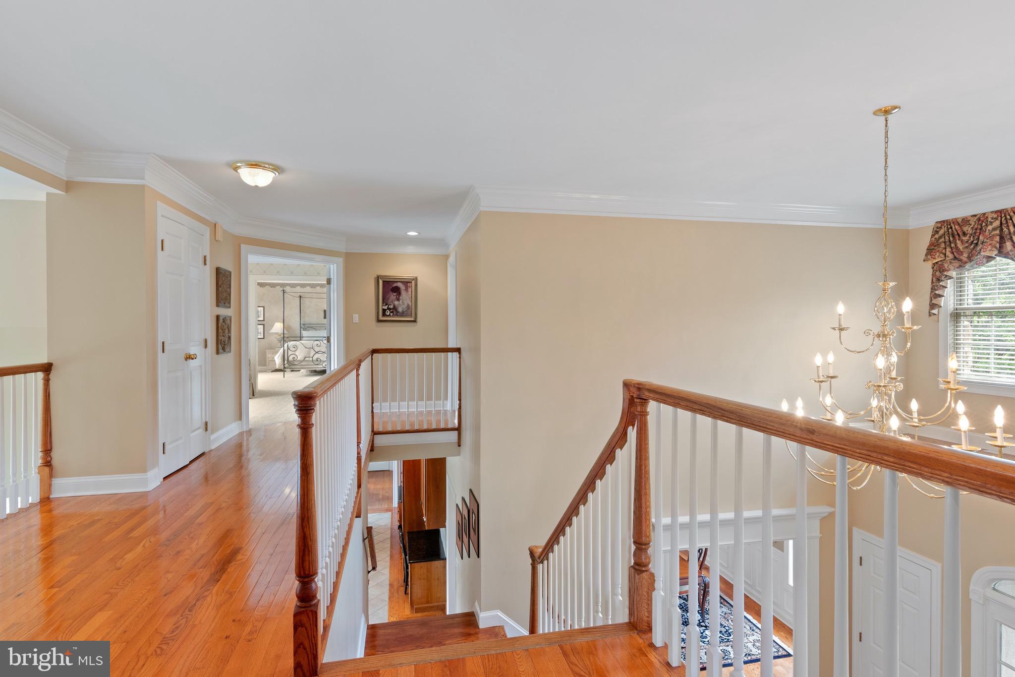 1860 Covered Bridge Road Malvern, PA 19355 - Photo 35 of 59 a view of a hallway with wooden floor and staircase