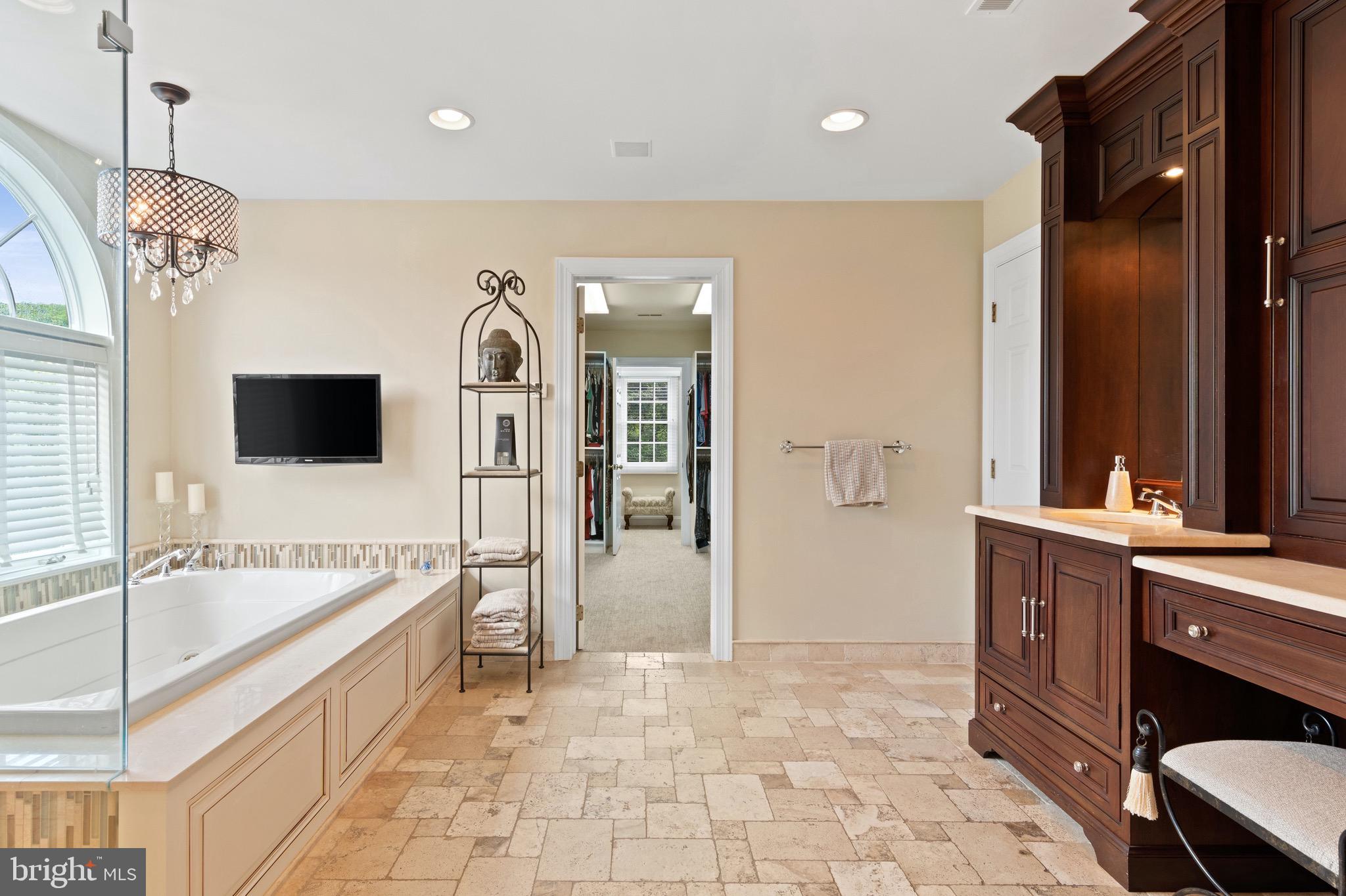 1860 Covered Bridge Road Malvern, PA 19355 - Photo 41 of 59 a spacious bathroom with a tub sink and mirror