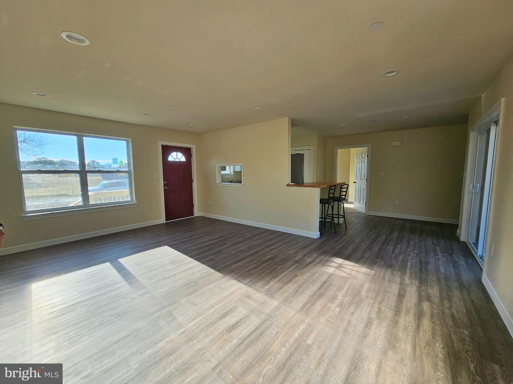 26404 Franklin Road Crisfield, MD 21817 - Photo 3 of 31 a view of empty room with wooden floor and fan