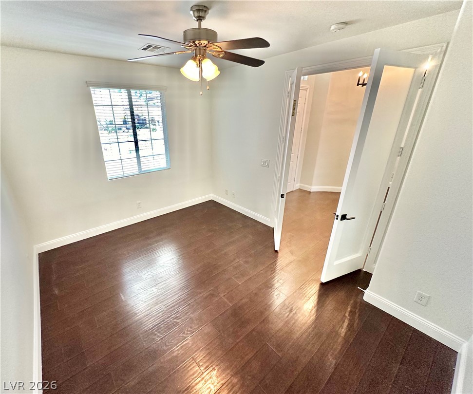 9996 Liberty View Road Las Vegas, NV 89148 - Photo 24 of 64 Spacious office with ceiling fan and frosted double French doors.