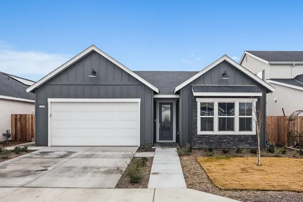 a front view of a house with garage
