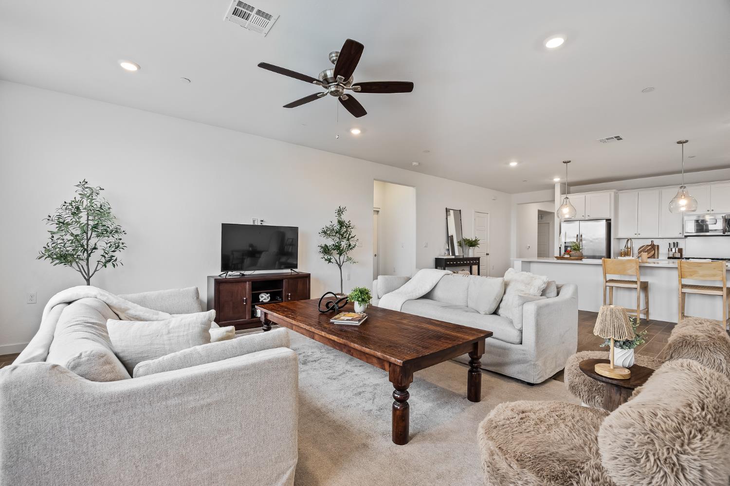 2601 Auburn Street Lemoore, CA 93245 - Photo 22 of 29 a living room with furniture and a flat screen tv