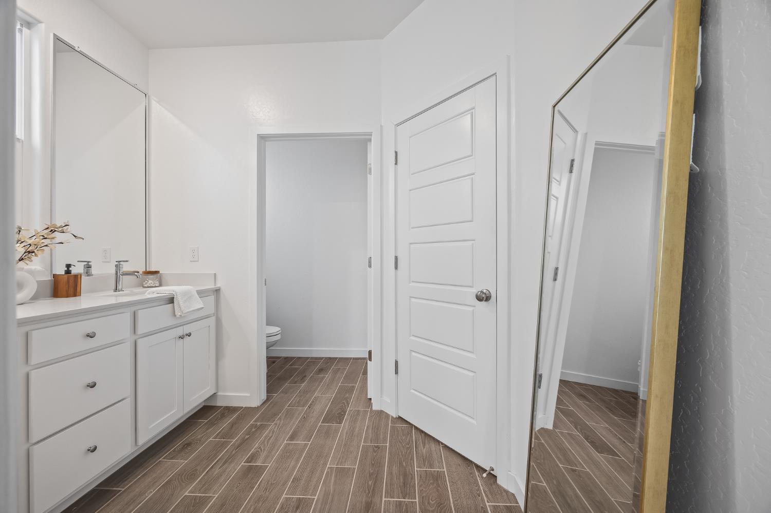 2601 Auburn Street Lemoore, CA 93245 - Photo 7 of 29 a bathroom with a double vanity sink and mirror