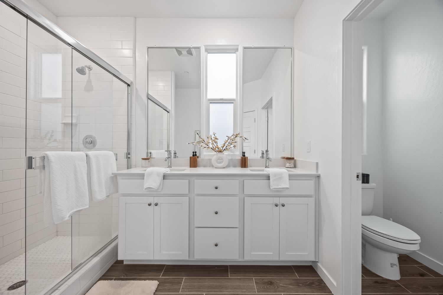 2601 Auburn Street Lemoore, CA 93245 - Photo 9 of 29 a bathroom with a double vanity sink mirror and toilet
