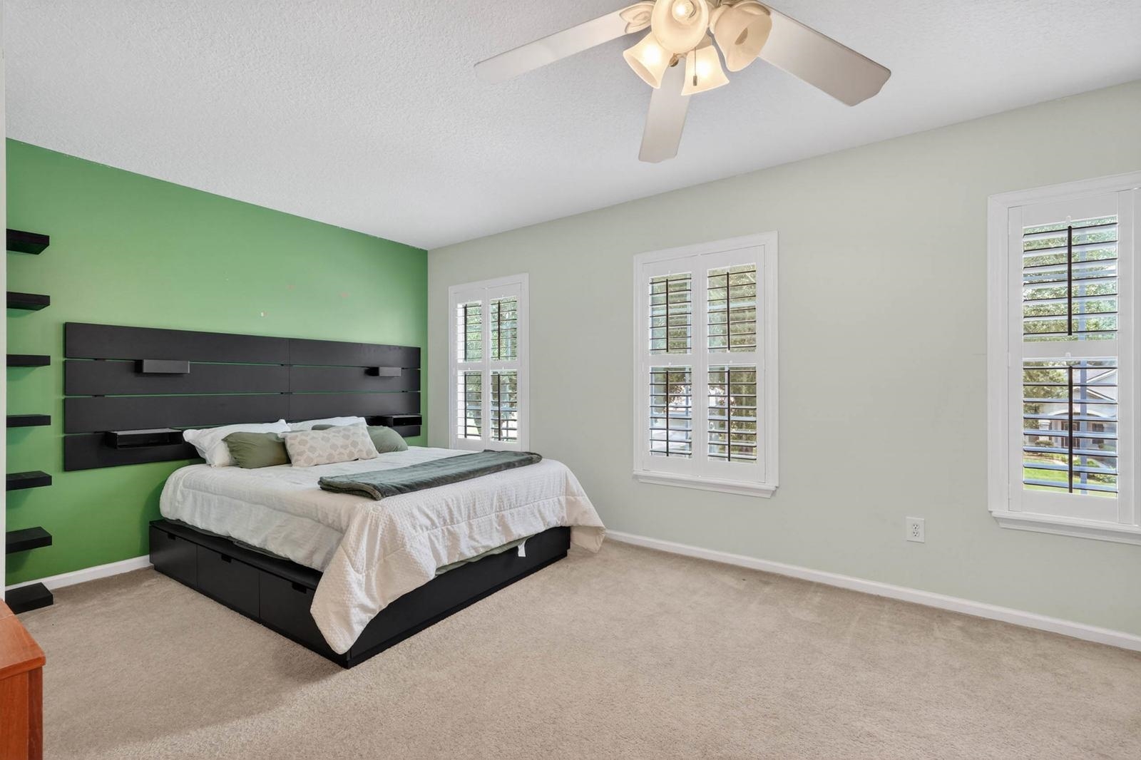 1237 Splendid Ravine Street St. Augustine, FL 32092 - Photo 28 of 62 a bedroom with a large bed chandelier and a window