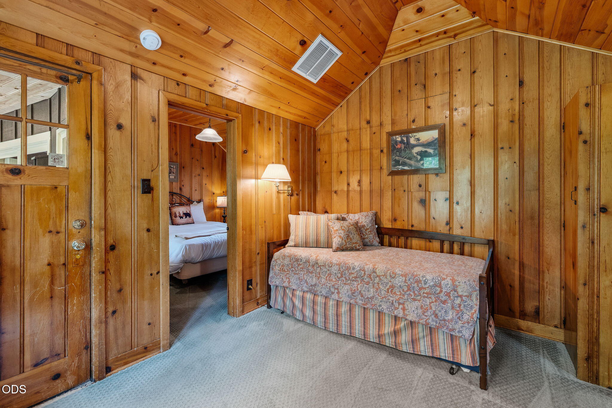 13375 Southwest Forest Service Road, Unit 3 U1 Camp Sherman, OR 97730 - Photo 20 of 29 a bedroom with a bed and a chandelier
