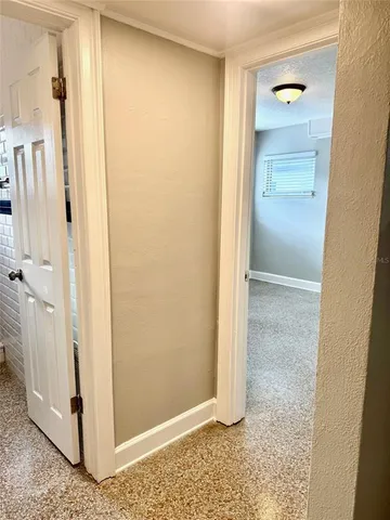 a view of a bathroom with a glass shower door