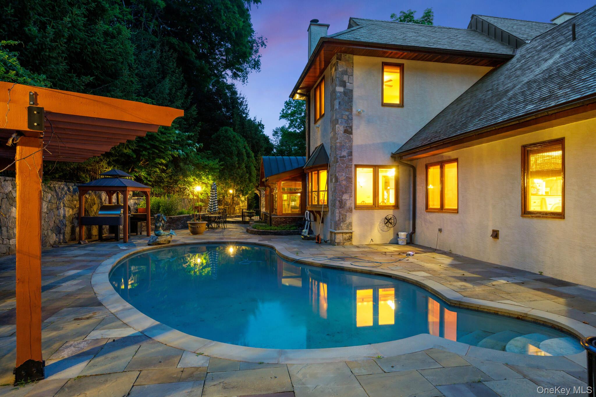 23 Inningwood Road Ossining, NY 10562 - Photo 8 of 50 Freeform swimming pool surrounded by a paver patio