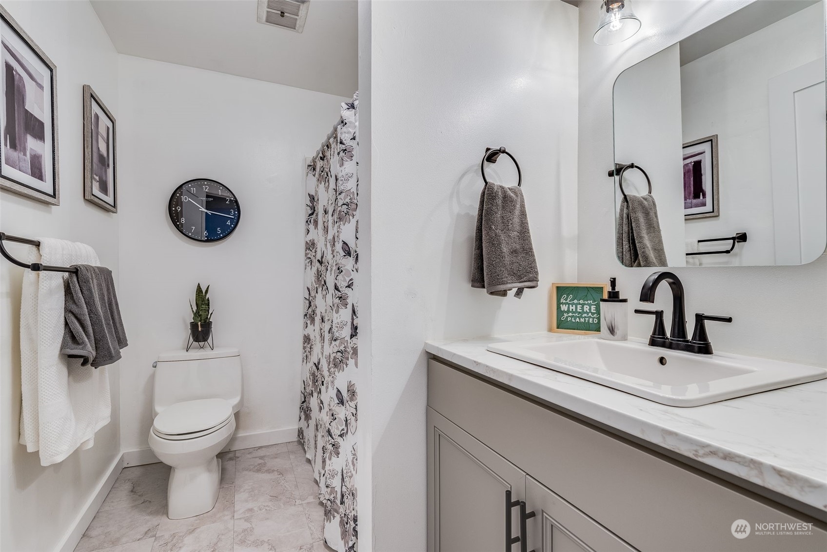 3617 Northeast 12th Street Renton, WA 98056 - Photo 14 of 33 a bathroom with a toilet sink and mirror