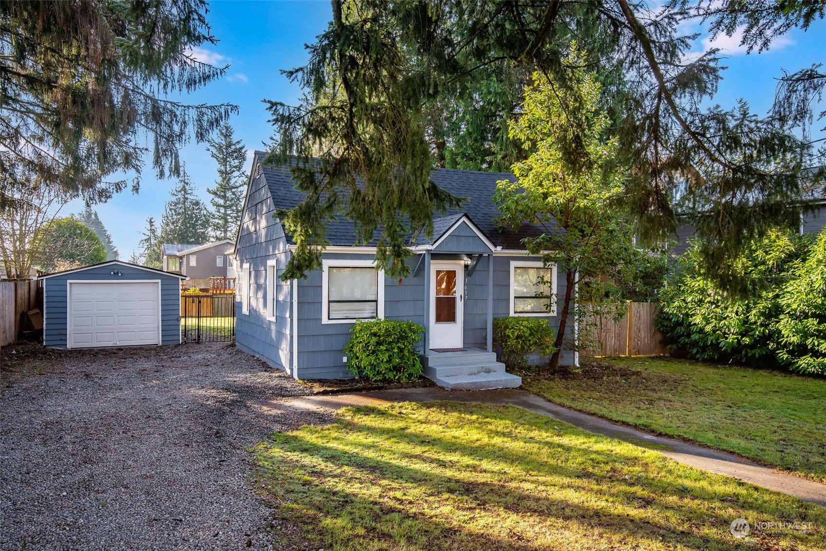 3617 Northeast 12th Street Renton, WA 98056 - Photo 2 of 33 a front view of a house with garden