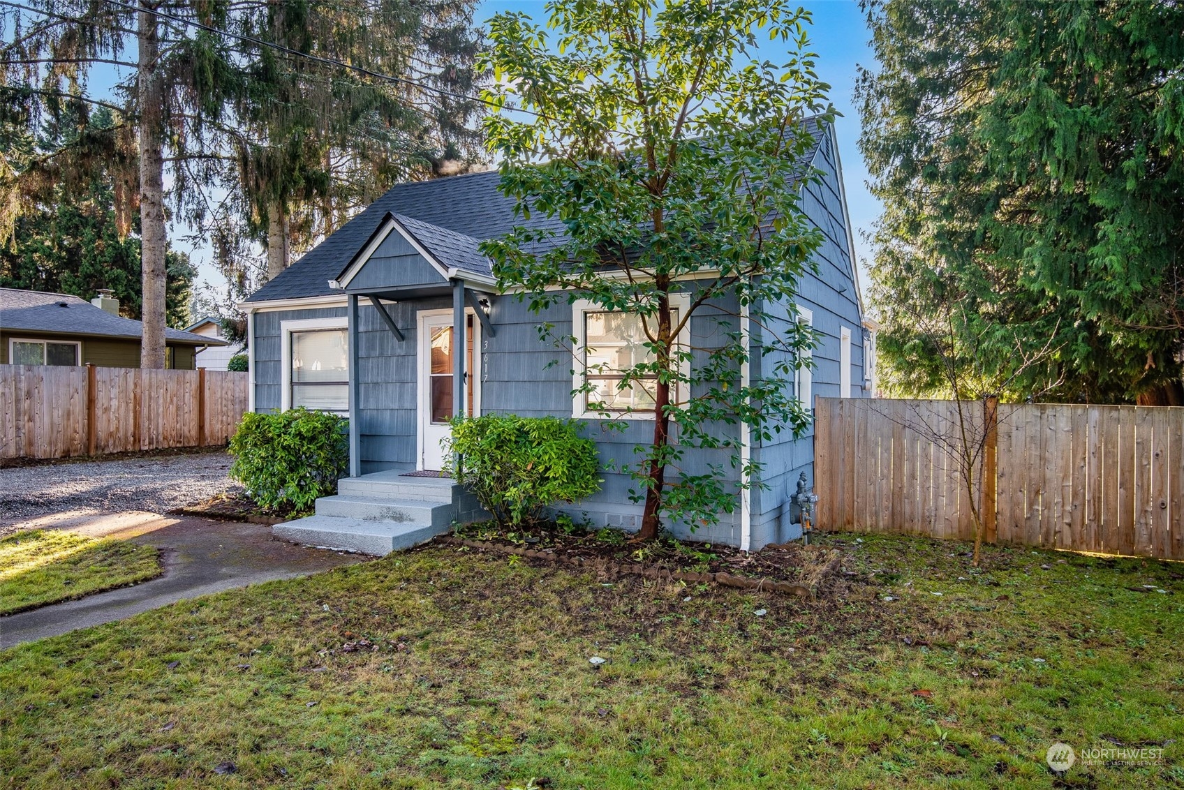 3617 Northeast 12th Street Renton, WA 98056 - Photo 3 of 33 a front view of a house with garden