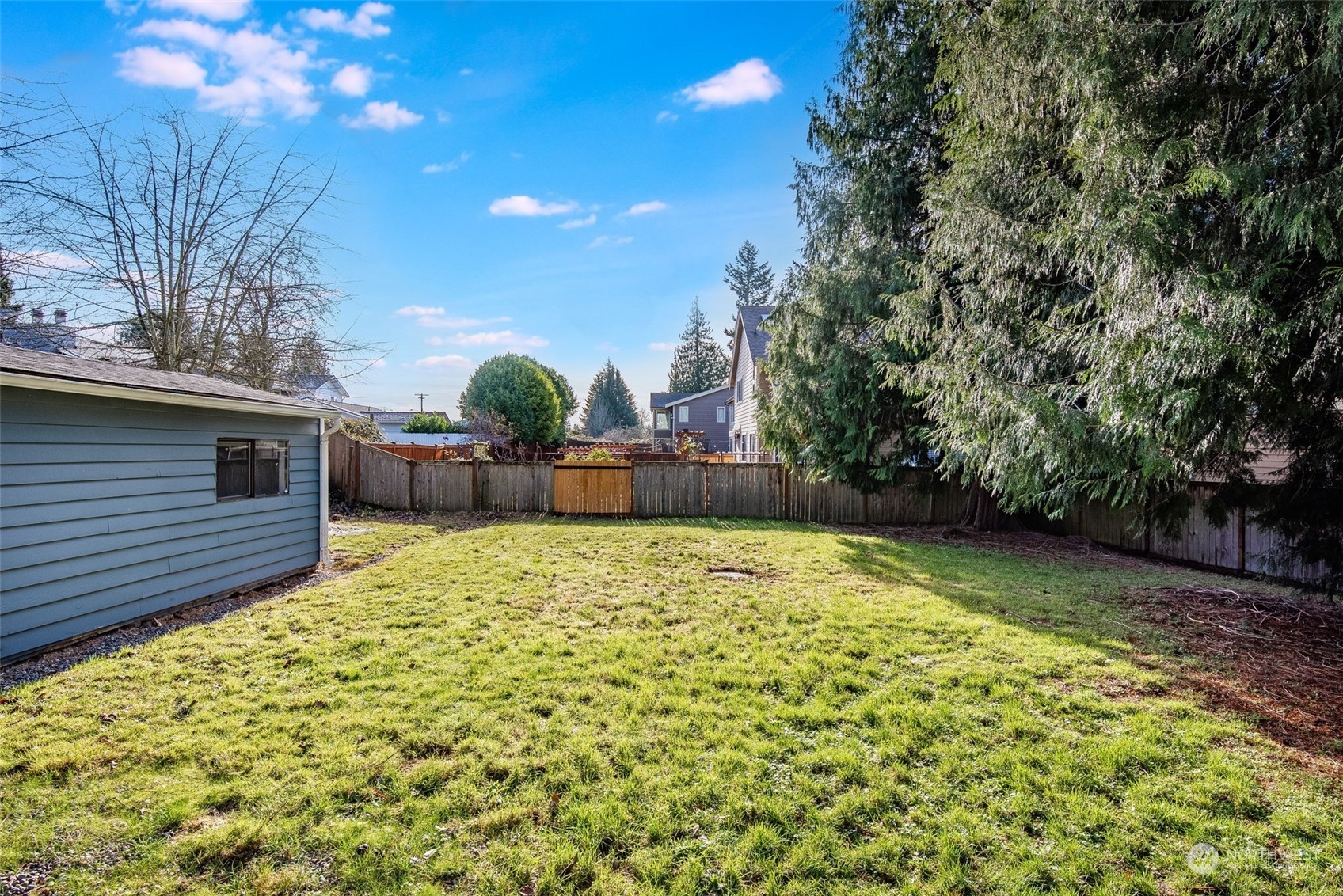3617 Northeast 12th Street Renton, WA 98056 - Photo 32 of 33 a view of a backyard with large trees