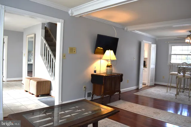 a living room with furniture and a table