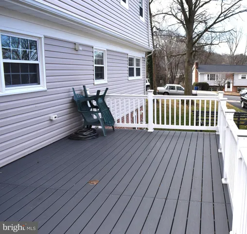 a view of a wooden deck with a bench