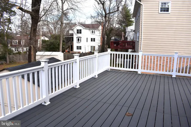 a view of a balcony with wooden floor