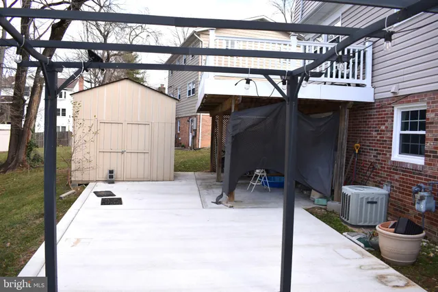 a backyard with a table and chairs