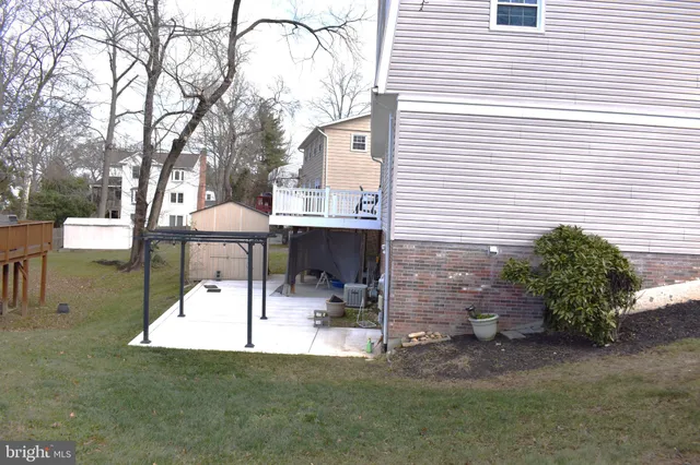 a view of a patio with a table and chairs