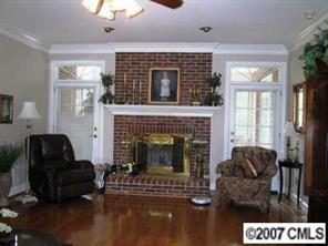 2704 Farmlake Lane Fort Mill, SC 29708 - Photo 2 of 8 a living room with furniture and a fireplace