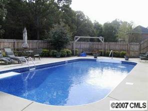 2704 Farmlake Lane Fort Mill, SC 29708 - Photo 7 of 8 a view of a swimming pool with a sitting space