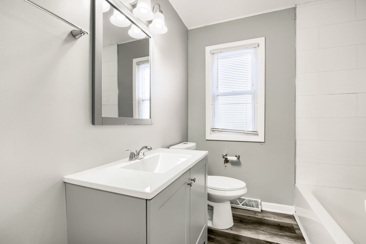 15013 Springfield Avenue Midlothian, IL 60445 - Photo 14 of 17 a bathroom with a sink toilet and a mirror
