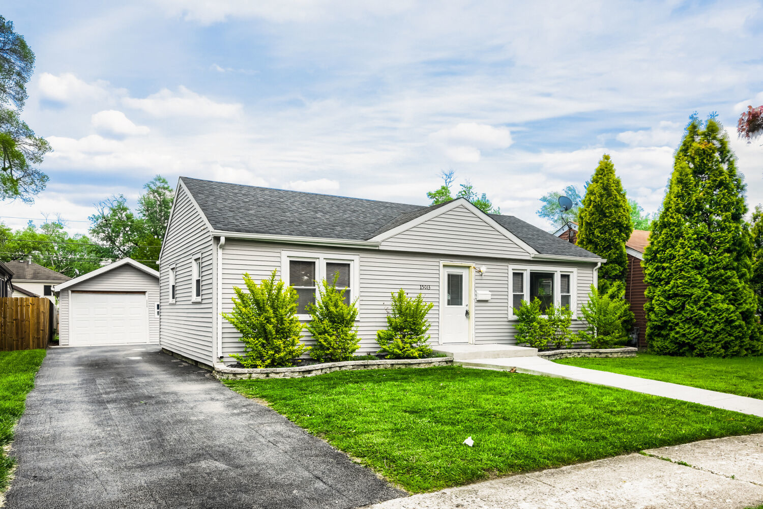 15013 Springfield Avenue Midlothian, IL 60445 - Photo 2 of 17 a front view of house with yard and green space