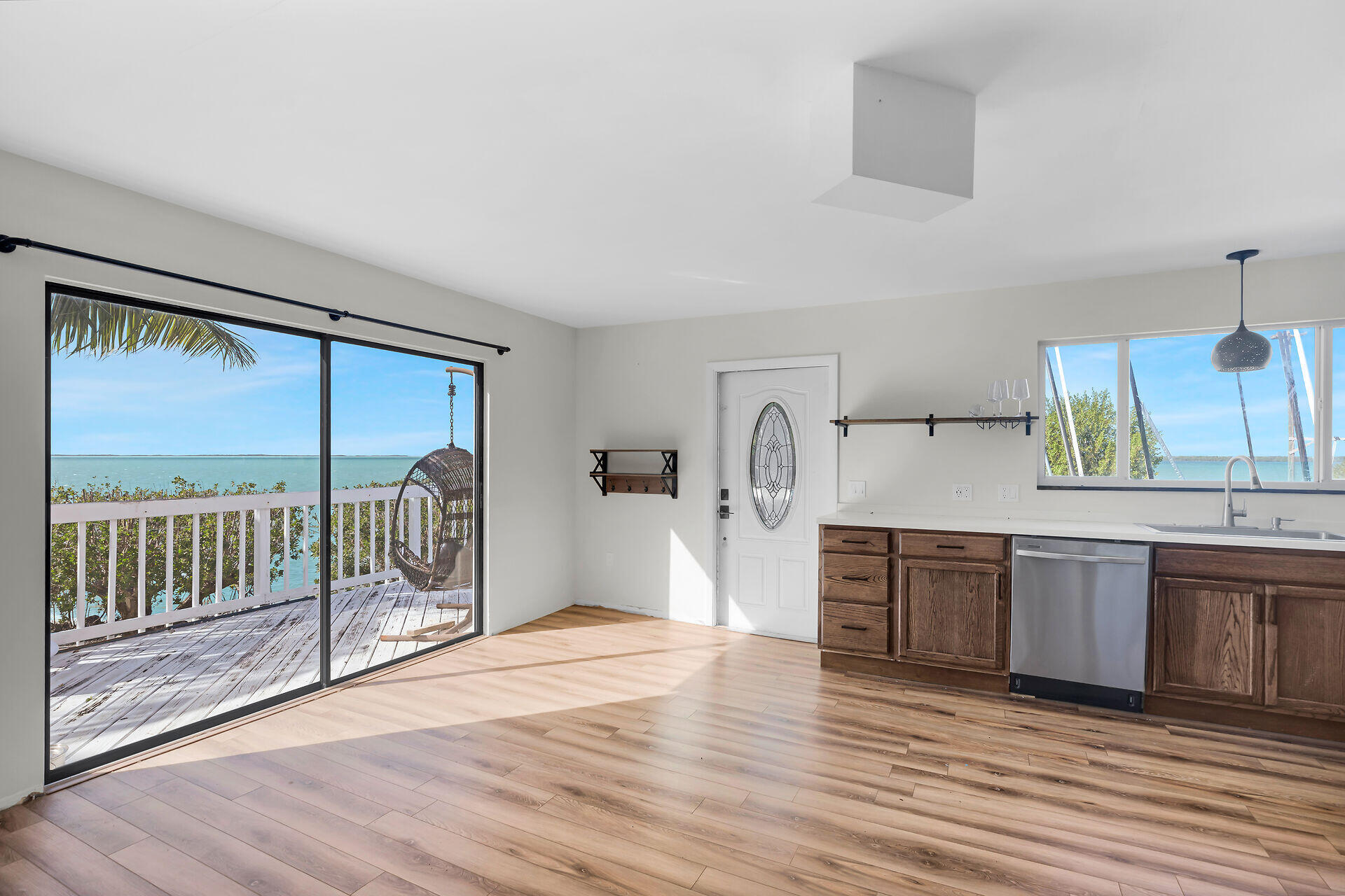 100 Point Pleasant Drive Key Largo, FL 33037 - Photo 15 of 32 a view of a kitchen with a sink and wooden floor