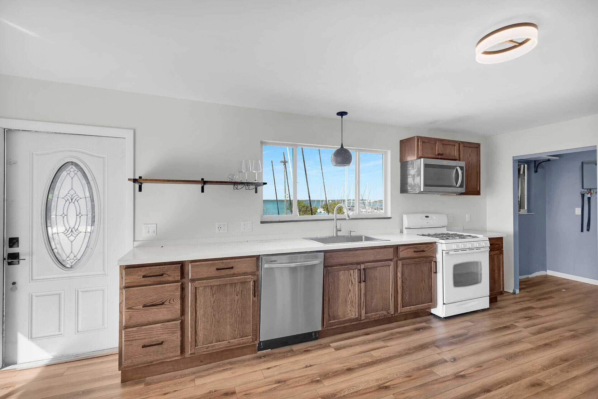 100 Point Pleasant Drive Key Largo, FL 33037 - Photo 17 of 32 a view of a kitchen with cabinets and wooden floor