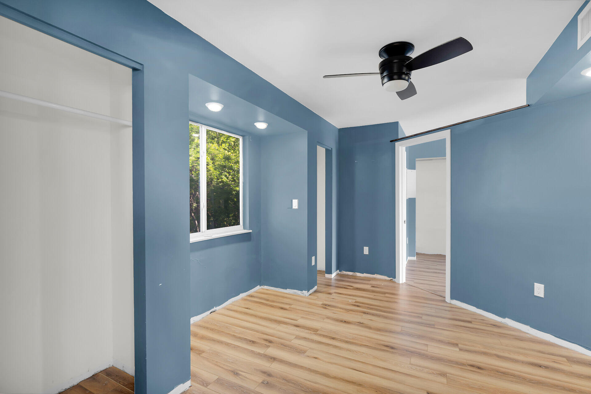 100 Point Pleasant Drive Key Largo, FL 33037 - Photo 19 of 32 a bedroom with a bed and a chandelier