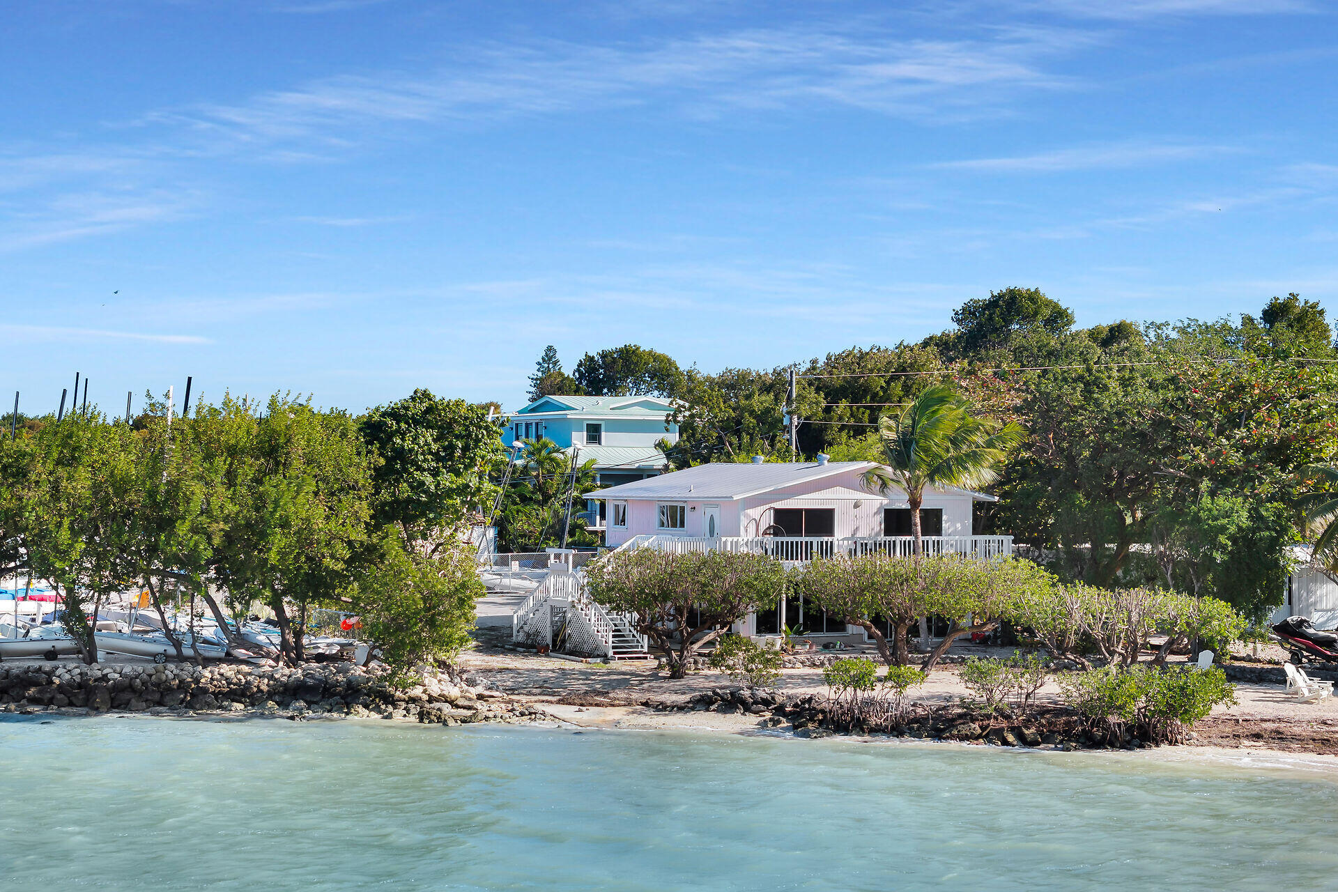100 Point Pleasant Drive Key Largo, FL 33037 - Photo 3 of 32 a view of a lake with a house in the background