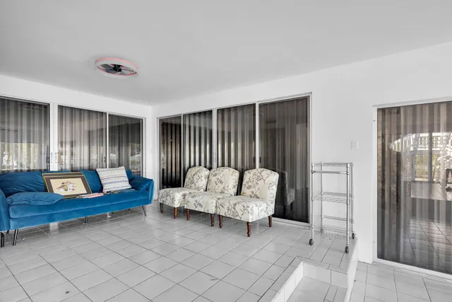 a living room with furniture and a rug