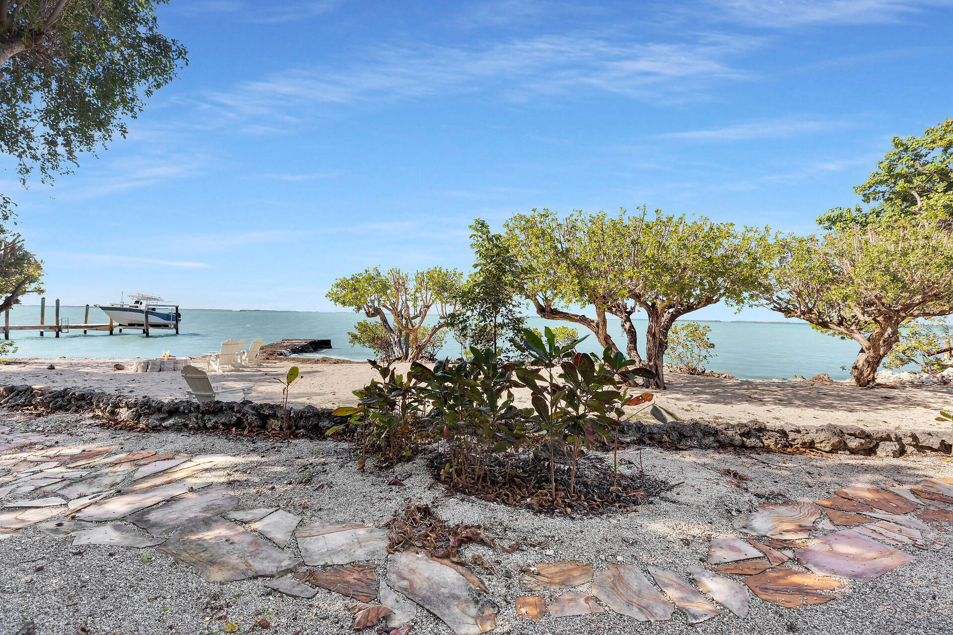 100 Point Pleasant Drive Key Largo, FL 33037 - Photo 7 of 32 a view of a dry yard with wooden fence
