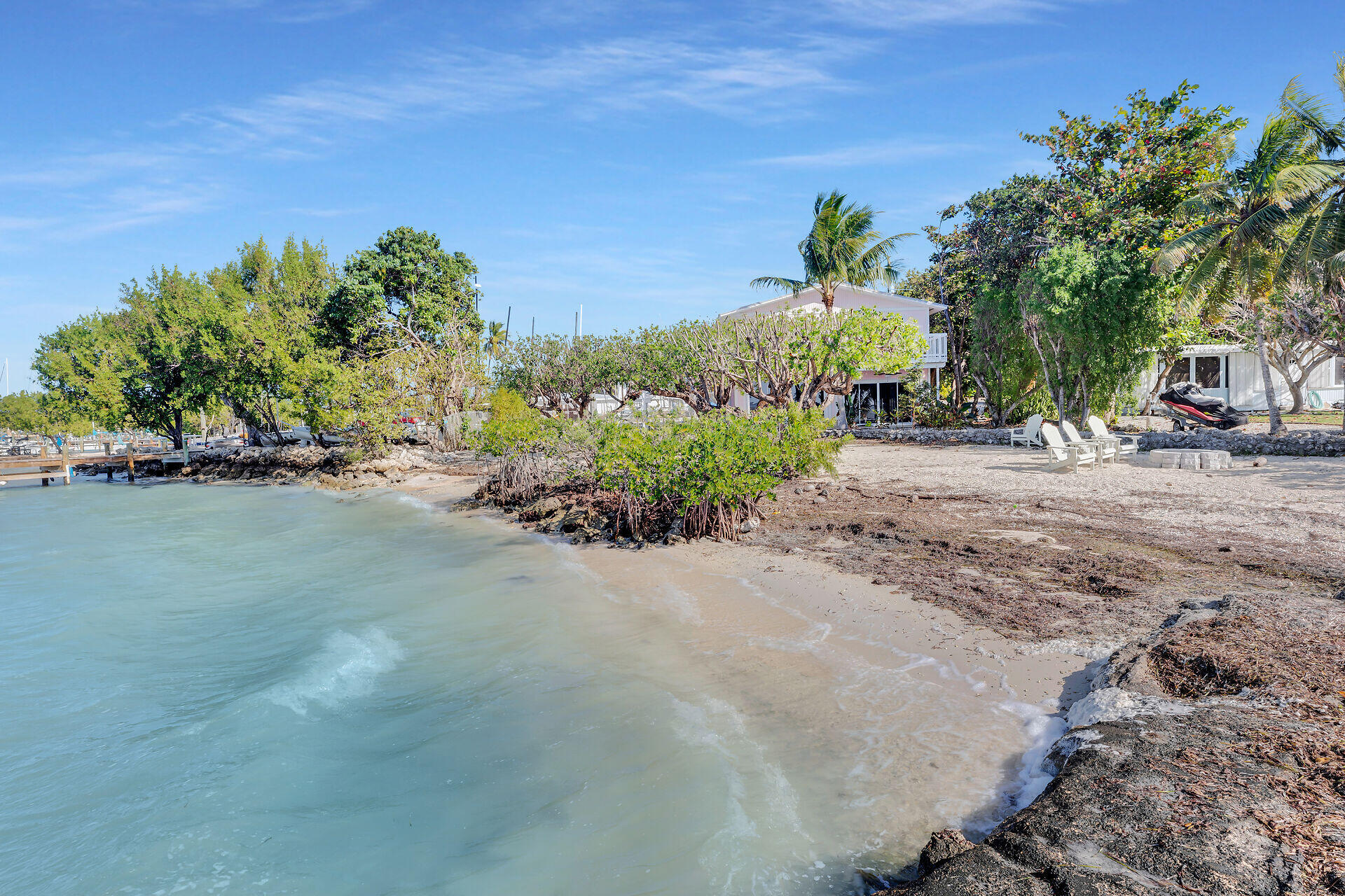 100 Point Pleasant Drive Key Largo, FL 33037 - Photo 9 of 32 a view of a street with a building in the background
