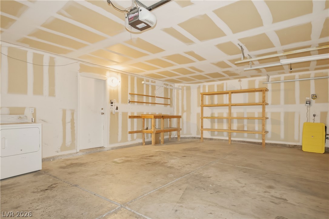 5100 Rancher Avenue Las Vegas, NV 89108 - Photo 23 of 26 A spacious garage offering ample storage and utility connections.