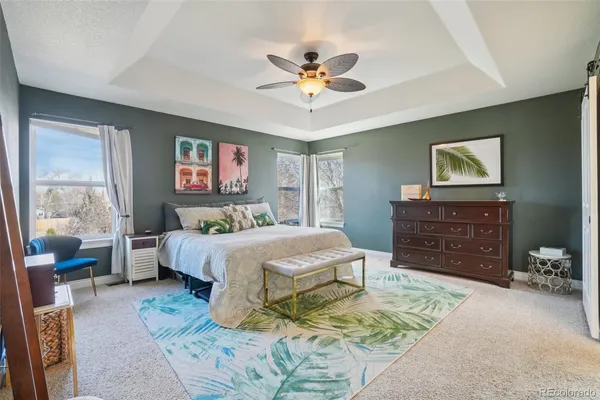 a bedroom with a bed a dresser and a window